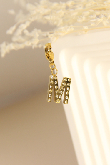 Wholesaler Bellissima - Charm's letter "M" pendant decorated with rhinestones in stainless steel