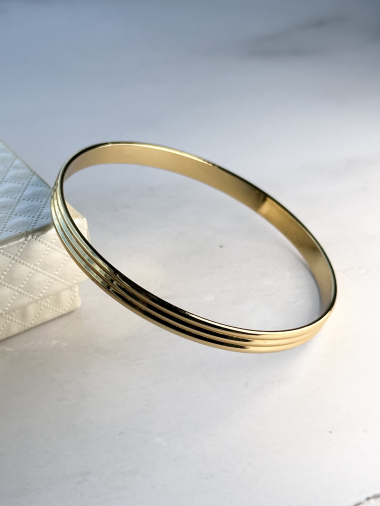 Grossiste Ceramik - Bracelet jonc fin en acier inoxydable semainier forme onde doré