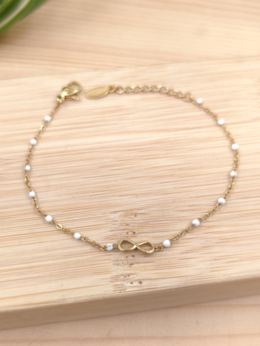 Grossiste Glam Chic - Bracelet perle couleur avec infini en acier inoxydable