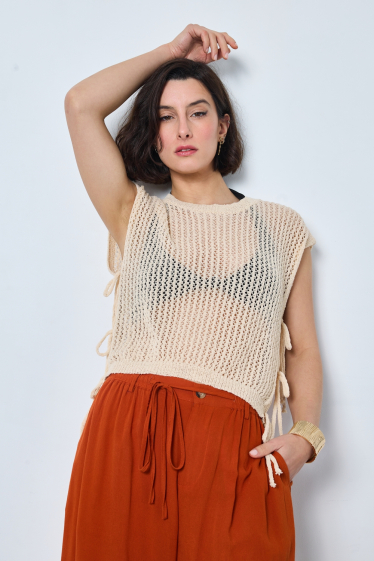 Wholesaler JCL Paris - Beige knit sleeveless top. It features a V-neckline and ribbed finishes
