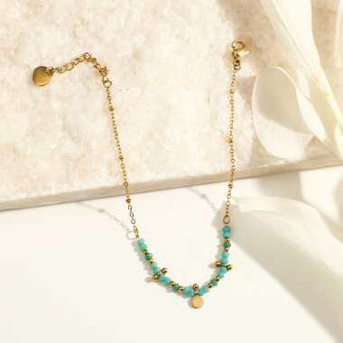 Grossiste Eclat Paris - Bracelet chaîne dorée avec perles bleues et pampille ronde