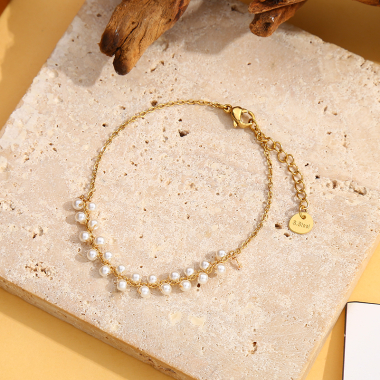 Grossiste Eclat Paris - Bracelet doré avec multi perle synthétique