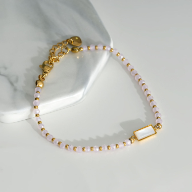 Grossiste Eclat Paris - Bracelet doré avec pierre rose