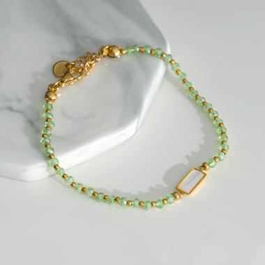 Grossiste Eclat Paris - Bracelet doré avec pierre verte
