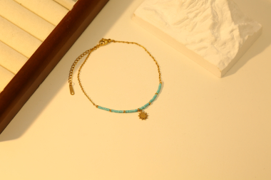 Wholesaler Eclat Paris - Gold anklet with blue beads and sun pendant
