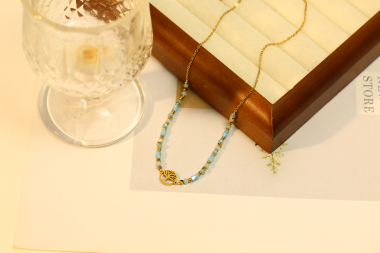 Grossiste Eclat Paris - Collier doré avec pendentif arbre et pierre nature bleue