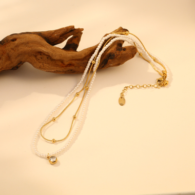 Mayorista Eclat Paris - Collar de doble cadena dorada con colgante de perlas y pedrería