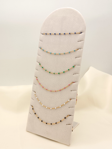 Wholesaler Eclat Paris - Set of 6 colorful gold chain necklaces on display