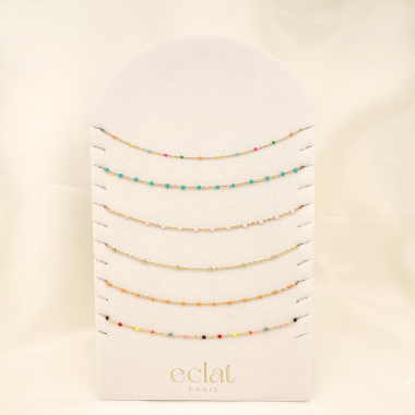 Wholesaler Eclat Paris - Set of 6 colorful golden necklaces on display