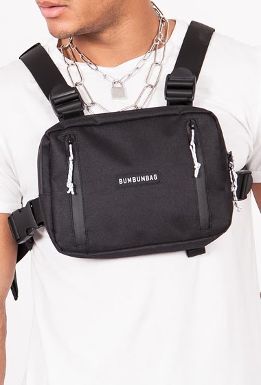 Small chest bag with black text zips